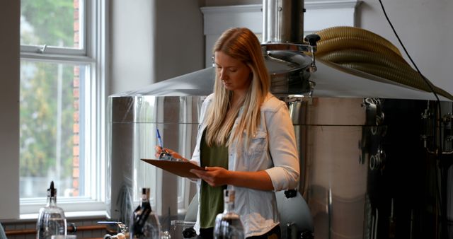 Female Brewer Analyzing Notes in Craft Brewery - Download Free Stock Images Pikwizard.com