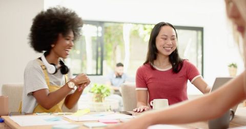 Diverse Female Coworkers Collaborating in Modern Office