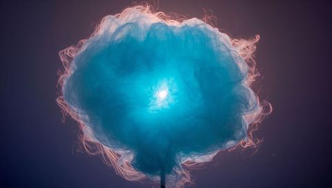 Glowing blue cotton candy floating on stick showing backlit halo and soft texture