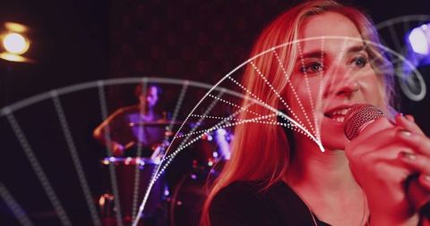 Female singer gripping microphone in red club lighting with drummer and dynamic light arcs
