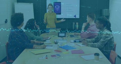 Businesswoman Leading Data-Driven Meeting in Modern Office