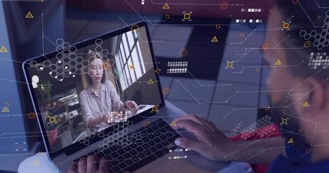 Collaborating remotely on laptop with digital network overlay and woman in video call