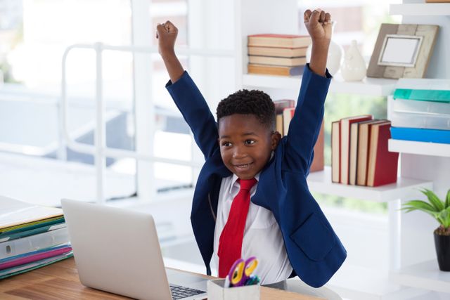 Joyful Young Businessman Celebrating Success at Desk - Download Free Stock Photos Pikwizard.com