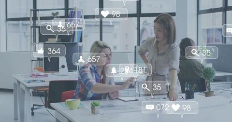 Colleagues collaborating in modern open office with social media engagement overlays