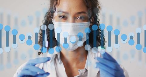 healthcare professional with dna strand overlay for scientific advancements - Download Free Stock Images Pikwizard.com