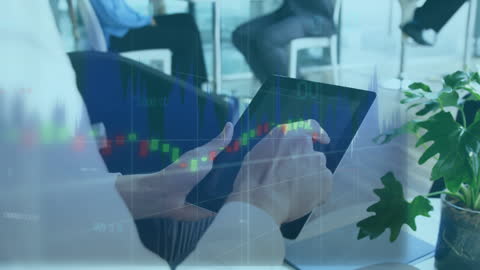 Modern Business Team Analyzing Financial Data on Digital Tablet