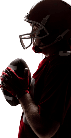 Silhouetted player holding football in transparent background