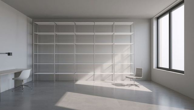 Sunlit minimalist office featuring large white multi-tier shelving unit and modern seating