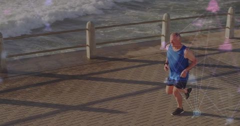 Senior man jogging on scenic ocean walkway