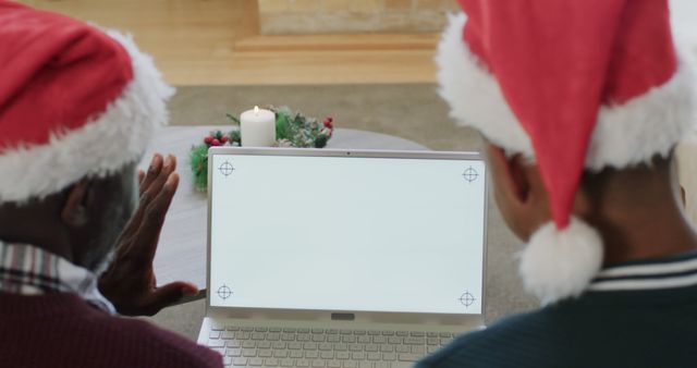 Two People in Santa Hats Video Calling Family on Christmas Holiday - Download Free Stock Images Pikwizard.com