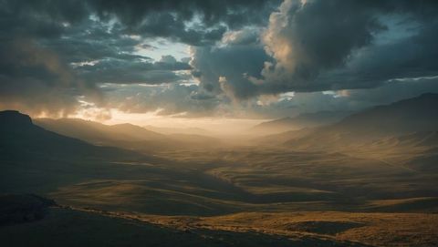 Sunlit Mountain Valley with Dramatic Clouds and Rolling Hills at Sunset - Download Free Stock Images Pikwizard.com