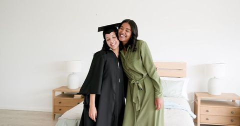 Graduate Embracing Family in Cap and Gown Celebrating Achievement