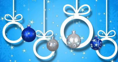 Festive Christmas Ornaments Hanging on Blue Background