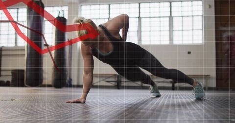 Holding one-arm plank building core strength with red performance arrow overlay