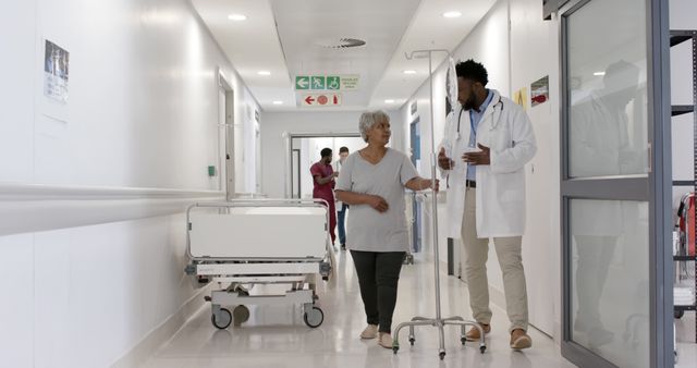 Doctor Consulting Senior Patient in Hospital Corridor - Download Free Stock Images Pikwizard.com