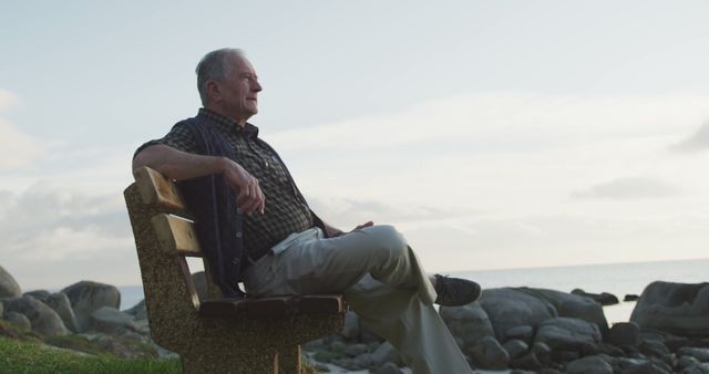 Senior Man Relaxing on Bench Facing Ocean at Sunset - Download Free Stock Images Pikwizard.com