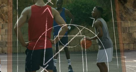 Strategizing basketball play with chalkboard diagram overlay outdoor game