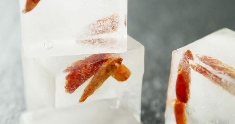 Chili peppers frozen in crystal clear ice cubes