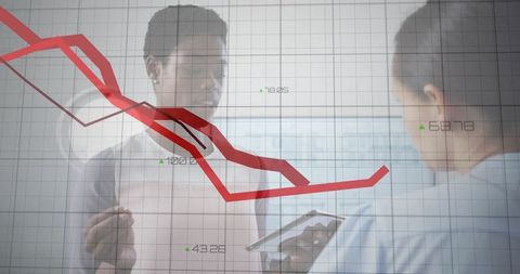 Business Professionals Analyzing Declining Financial Data with Technology