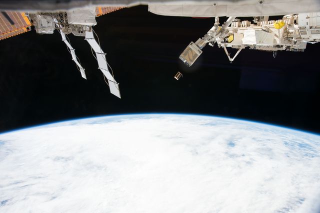 iss053e215850 (Nov. 20, 2017) --- The EcAMSat, short for E. coli AntiMicrobial Satellite, is seen moments after being ejected from the NanoRacks CubeSat Deployer attached to the outside of Kibo laboratory module from the Japan Aerospace Exploration Agency. The E. coli AntiMicrobial Satellite (EcAMSat) mission will investigate space microgravity effects on the antibiotic resistance of E. coli, a bacterial pathogen responsible for urinary tract infection in humans and animals.