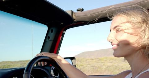 carefree road trip with young woman driving convertible - Download Free Stock Images Pikwizard.com