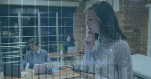 Businesswoman Analyzing Data in Office with Digital Interface - Download Free Stock Images Pikwizard.com