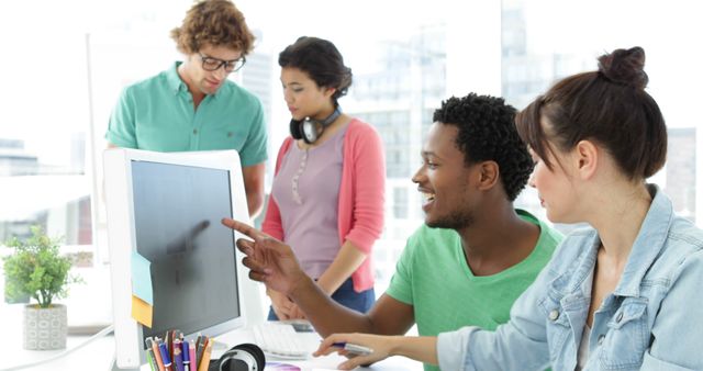 Group of Multiracial Colleagues Collaborating on Computer in Modern Office - Download Free Stock Images Pikwizard.com