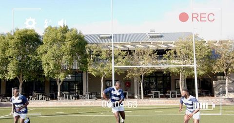 Three rugby players running on turf showing teamwork and goalposts with rec overlay
