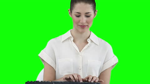 Businesswoman Typing on Keyboard with Chroma Key Background
