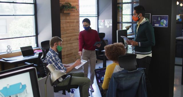 Diverse Office Team Collaborating While Wearing Masks - Download Free Stock Images Pikwizard.com