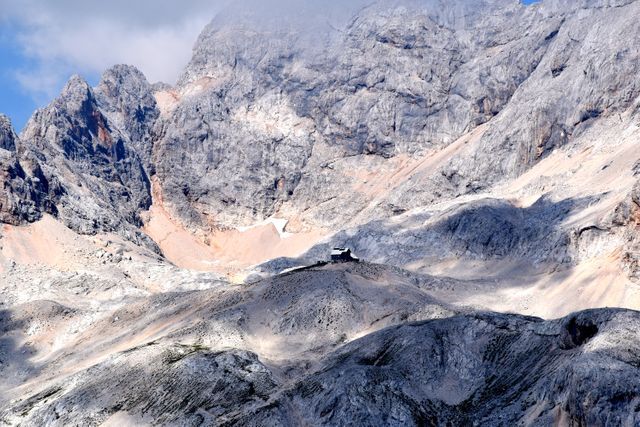 Remote Mountain Hut Nestled Amongst Rocky Peaks - Download Free Stock Photos Pikwizard.com
