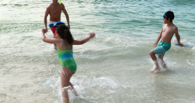 Family having fun during a beach vacation. Children enjoying playing in water, splashing waves. Wearing swimsuits and snorkel masks, enjoying outdoor activity in summer. Perfect for tourism promotions, vacation advertisements, family-oriented products, travel websites.