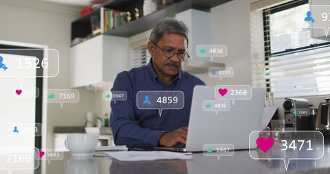 Senior Man Engaging with Social Media on Laptop