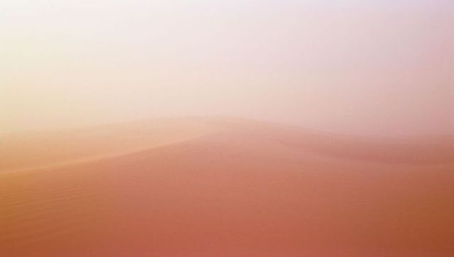 Serene Sand Dunes Under Pastel Skies at Desert Twilight