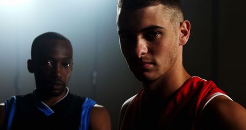 Determined Basketball Players Posing Confidently in Indoor Court - Download Free Stock Images Pikwizard.com
