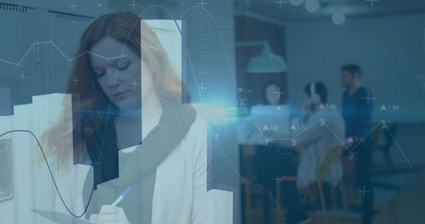 Red-Haired Woman Analyzing Data in Modern Office Setting