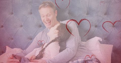 Father and Daughter Bonding with Tablet and Heart Motif