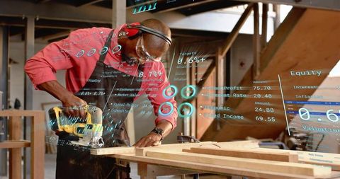 Carpenter Cutting Wood with Circular Saw in Workshop Surrounded by Augmented Data Overlay