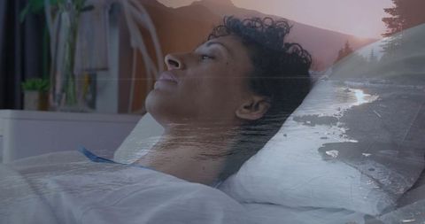 Pensive woman lying in bed gazing upward with river landscape double exposure for calm reflection