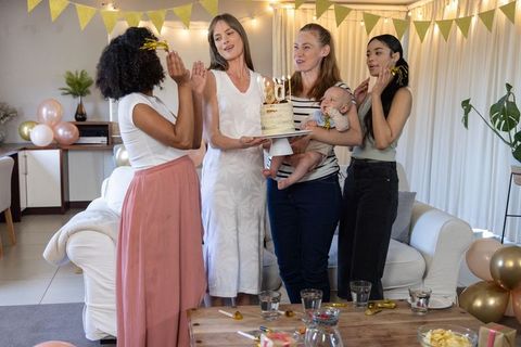 Diverse Women's Birthday Celebration in Cozy Living Room Setting