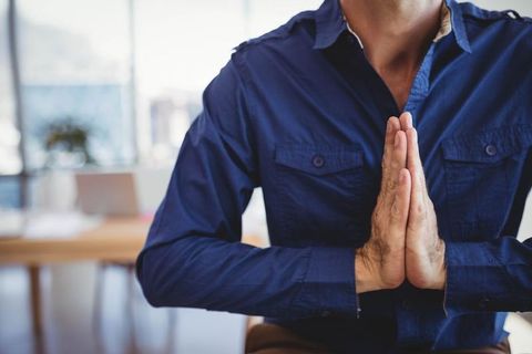 Business Professional Practicing Mindfulness Meditation at Work