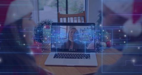 Family Connecting Over Festive Video Call at Dining Table with Digital Network Overlay