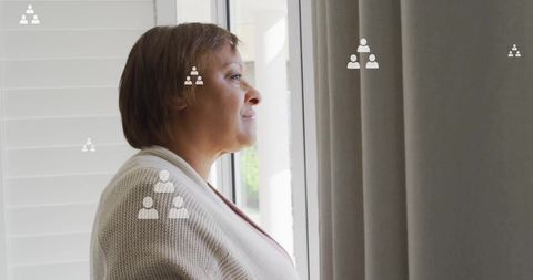 Elderly Woman Reflecting with Network Connection Icons Overlay