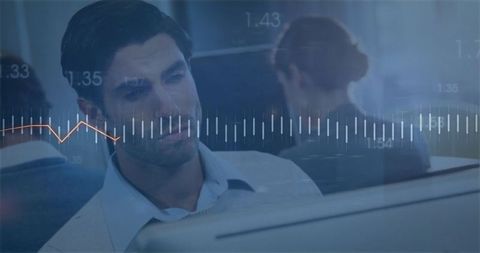 Focused Professional Reviewing Live Data with Waveform Overlay