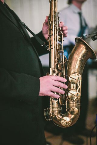Musician Hands Playing Saxophone at Jazz Performance