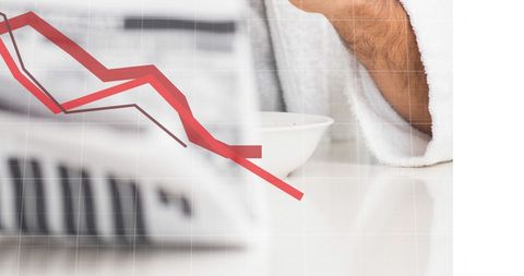 Caucasian Man Analyzing Stock Market Losses with Newspaper