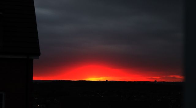 Vibrant Red Sunset over Silhouetted Urban Skyline - Download Free Stock Photos Pikwizard.com