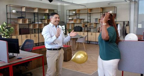 Colleagues Celebrating Successful Project in Modern Office