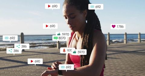 Athletic Woman Checking Smartwatch with Social Media Engagement Icons