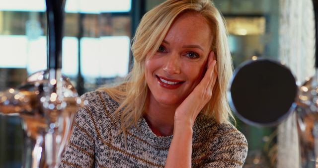 Smiling Blonde Woman Sitting in a Modern Cafe - Download Free Stock Images Pikwizard.com